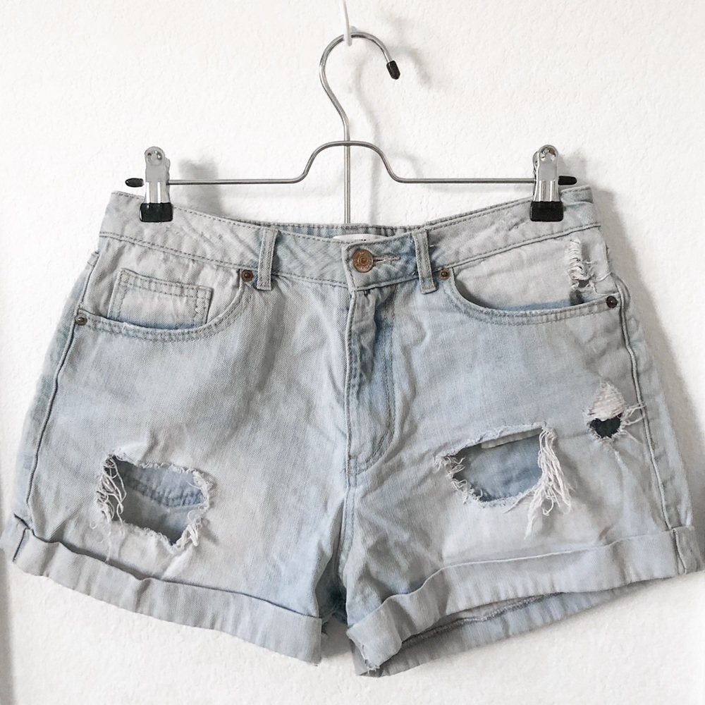 High-waisted distressed denim shorts